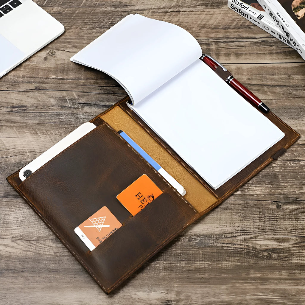 Brown Crazy Horse leather protective sleeve for an A5 notebook, showing square shape and socket closure.