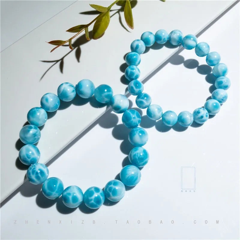 Blue handmade Bodhi bracelet with sea-pattern crystal stone and pearl accent in Maillard style.