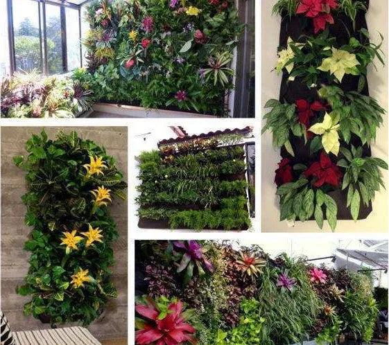 Green felt vertical wall planter with multiple planting pockets hanging on an outdoor wall.
