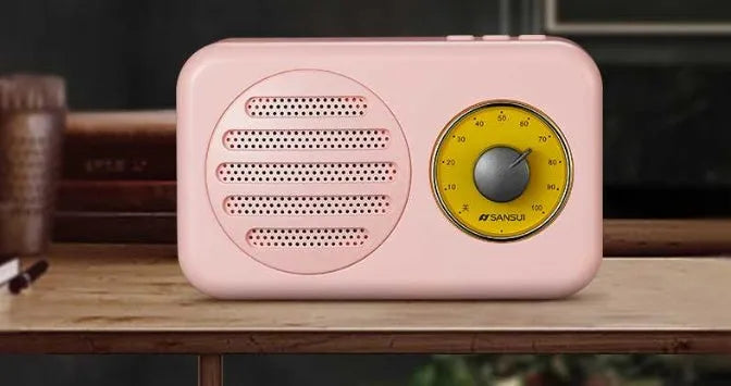 T1 portable Bluetooth speaker with wood grain finish showing compact design and speaker grille