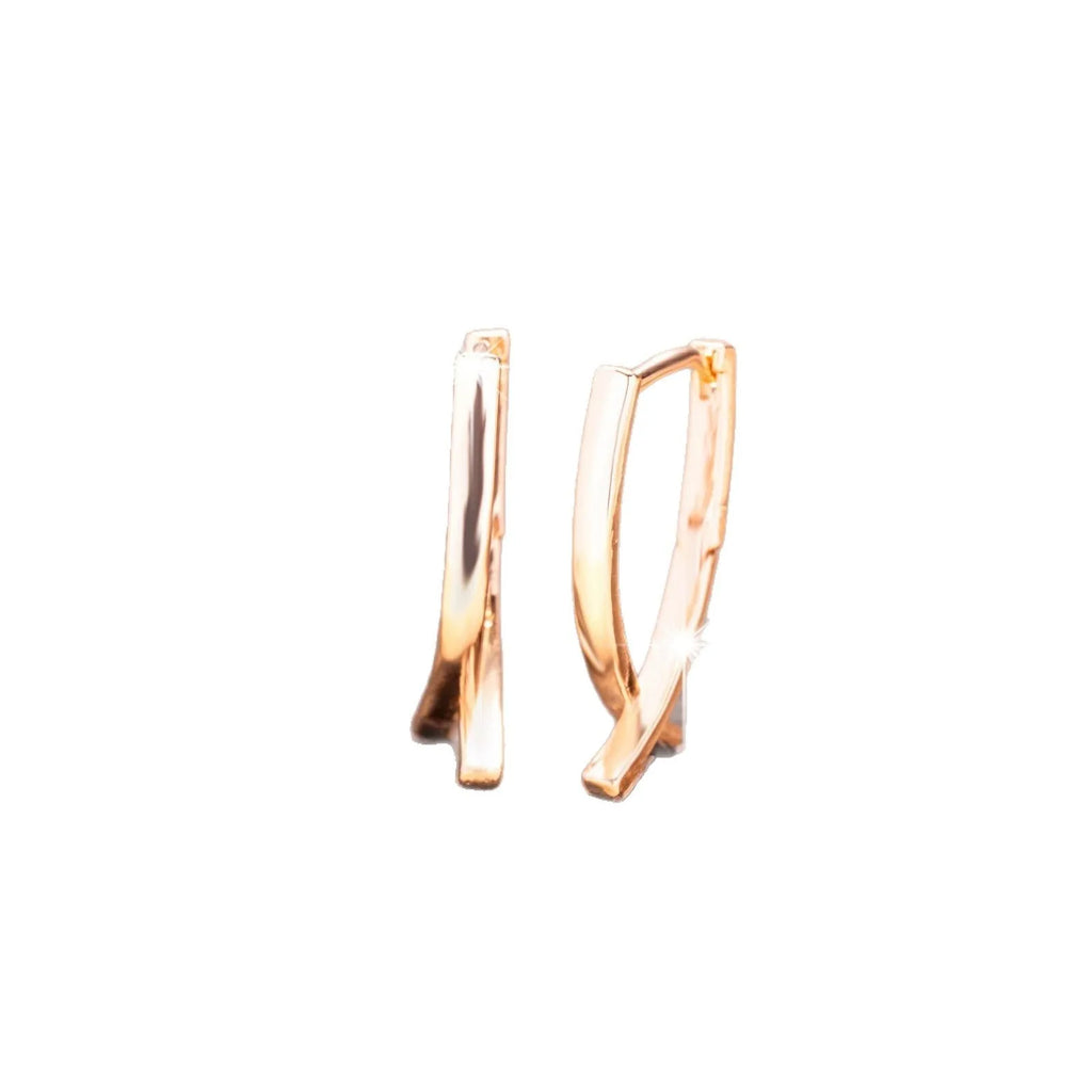 Rose gold copper cross shaped earrings with geometric design for pierced ears