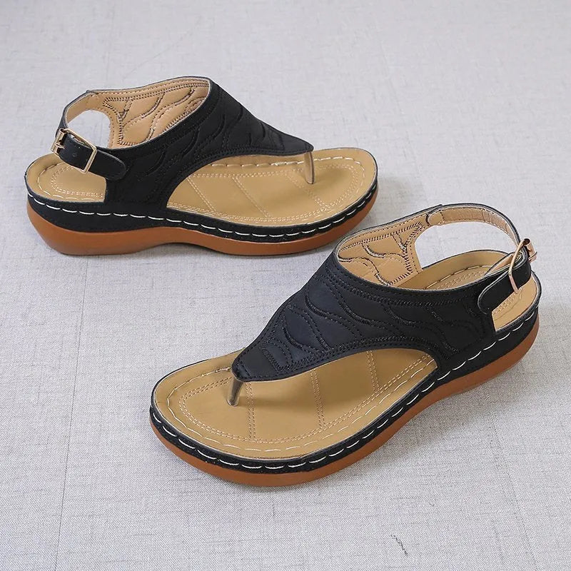 Women's casual wedge heel sandals in black with an adjustable back strap buckle.