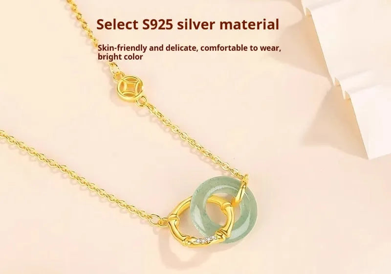 Handmade S925 sterling silver bamboo joint peace buckle necklace with pearl element on adjustable O-ring chain against neutral background