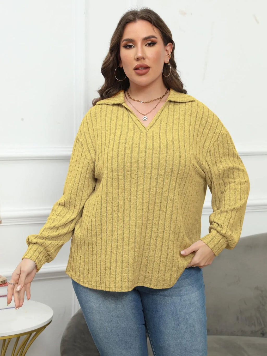 Women's plus size grey polar fleece shirt with a polo collar and lantern sleeves.