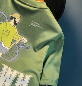 Green loose fit men's t-shirt with a large literary graphic print on the front.