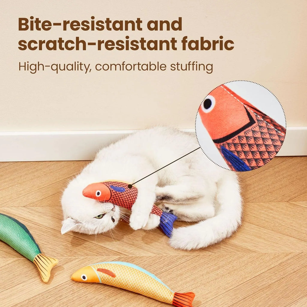 Soft green plush fish-shaped cat kicker toy with organic catnip filling on a neutral background