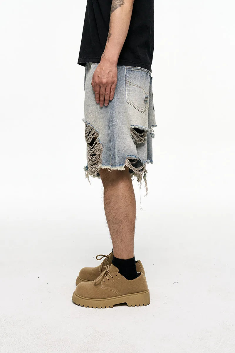 Light blue retro washed men's baggy denim shorts on a hanger showing wide leg fit.
