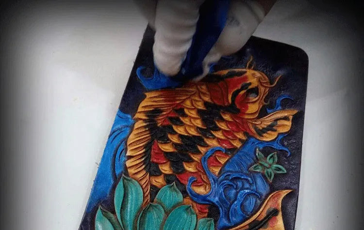 Men's cow leather carving wallet with open closure in red, blue, or gold colours showing texture detail