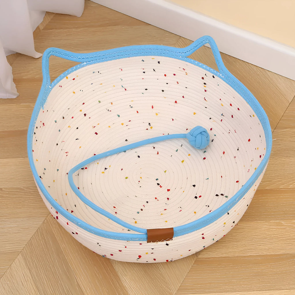Cotton and hemp rope cat nest mat in large size with dangling toy ball, placed inside a cage