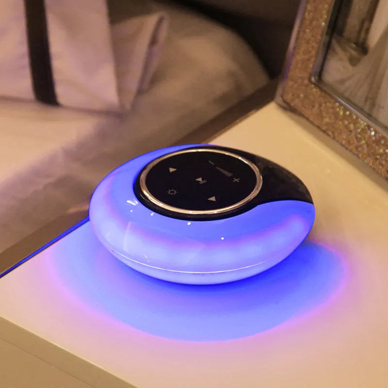Blue folding Bluetooth desk lamp speaker with touch controls and LED light.