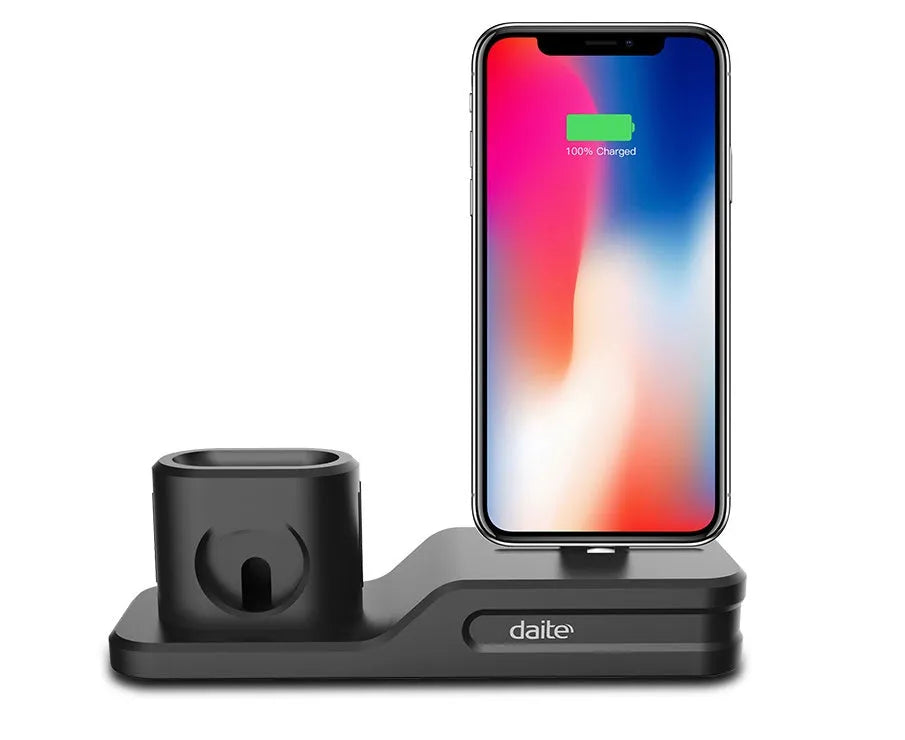 Black 3-in-1 silicone charging base for iPhone, iWatch, and AirPods on a desk