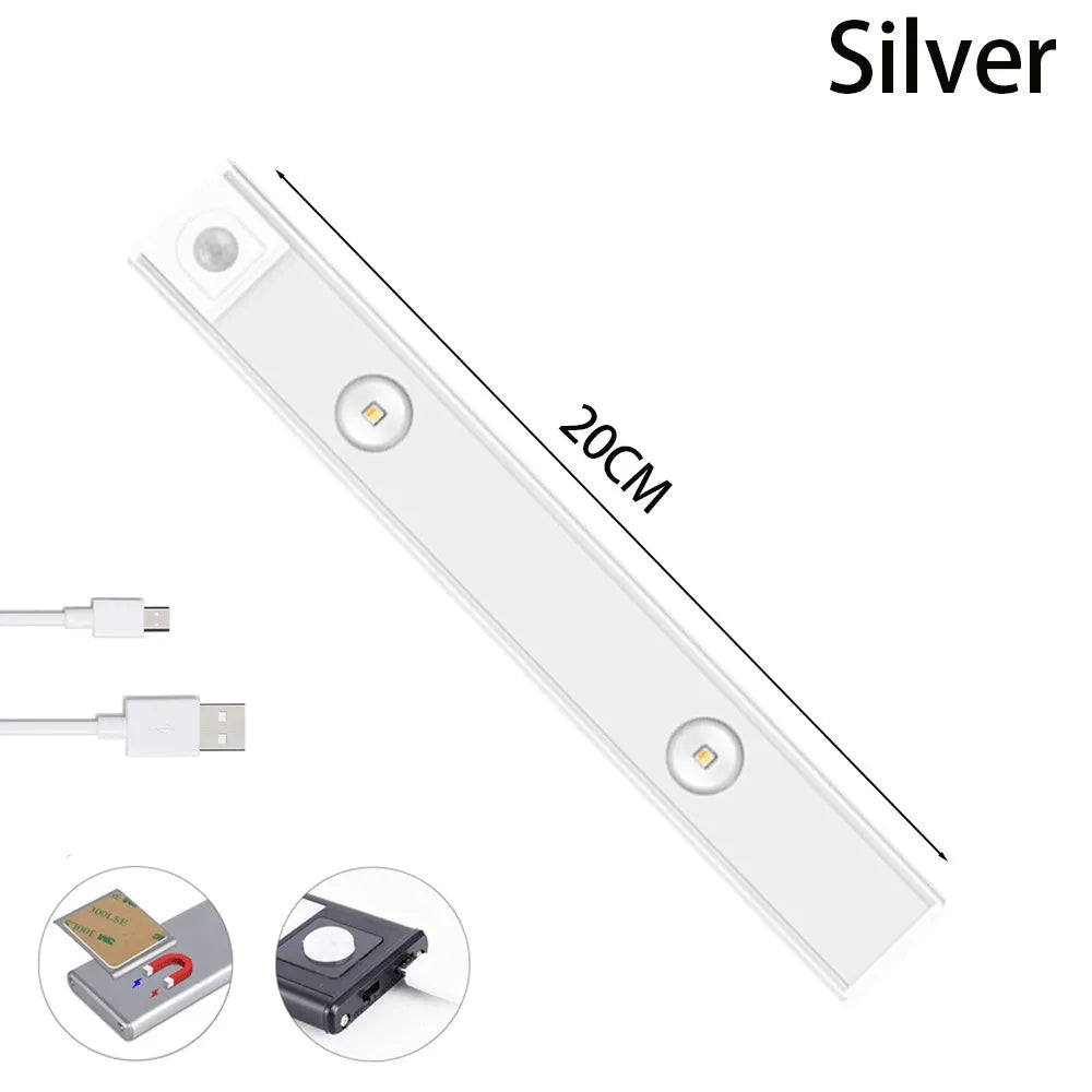 Ultra-thin USB LED night light with motion sensor in silver, aluminium body, 20 cm length, mounted inside a kitchen cabinet