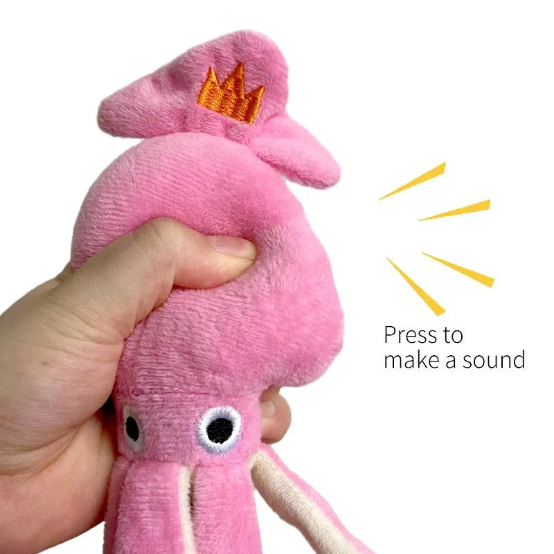 Pink squid-shaped plush dog chew toy with squeaky whistle, corduroy fabric, 32cm body length