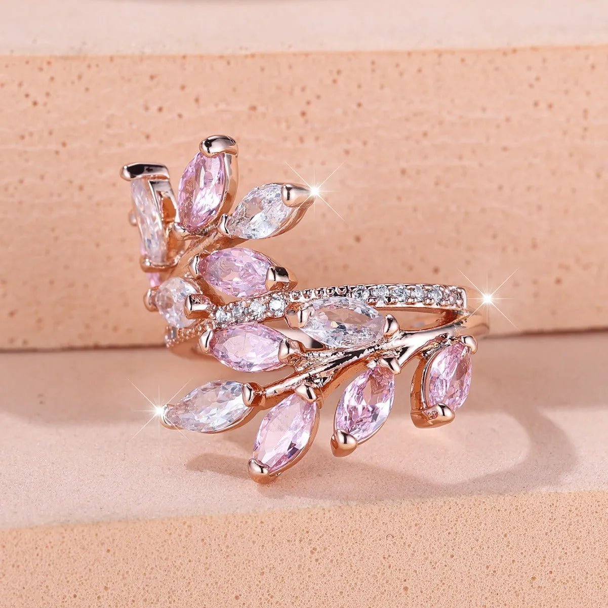Adjustable copper leaf ring with zircon stones in various colour settings including platinum and rose gold options