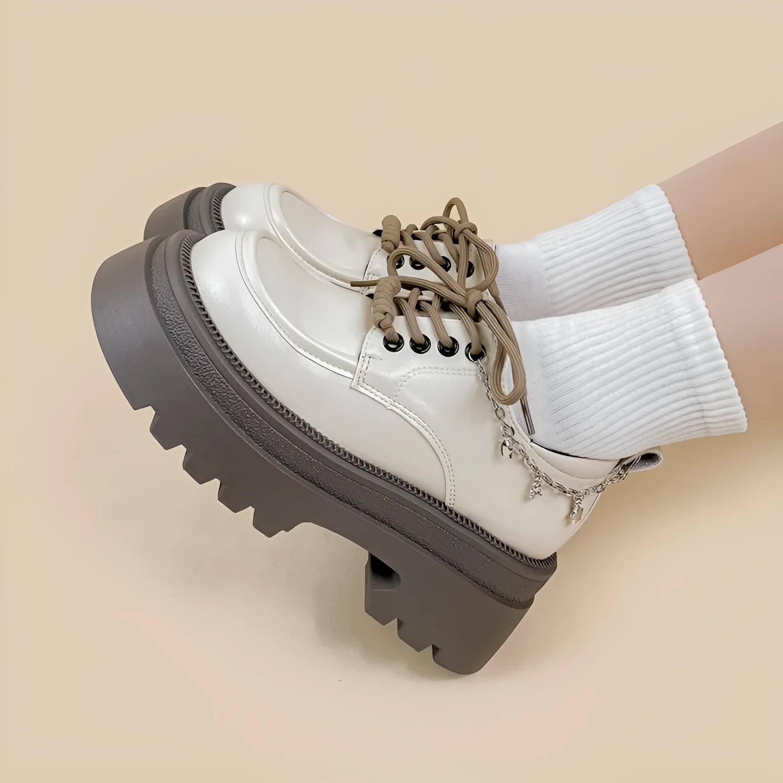 White women's Mary Jane platform shoes with thick chunky heel and front lace-up detail.