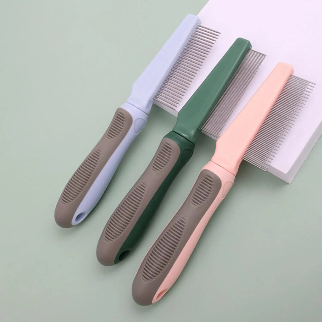 Pet detangler comb with round smooth teeth and rubber handle, available in blue or pink, for cat and dog grooming