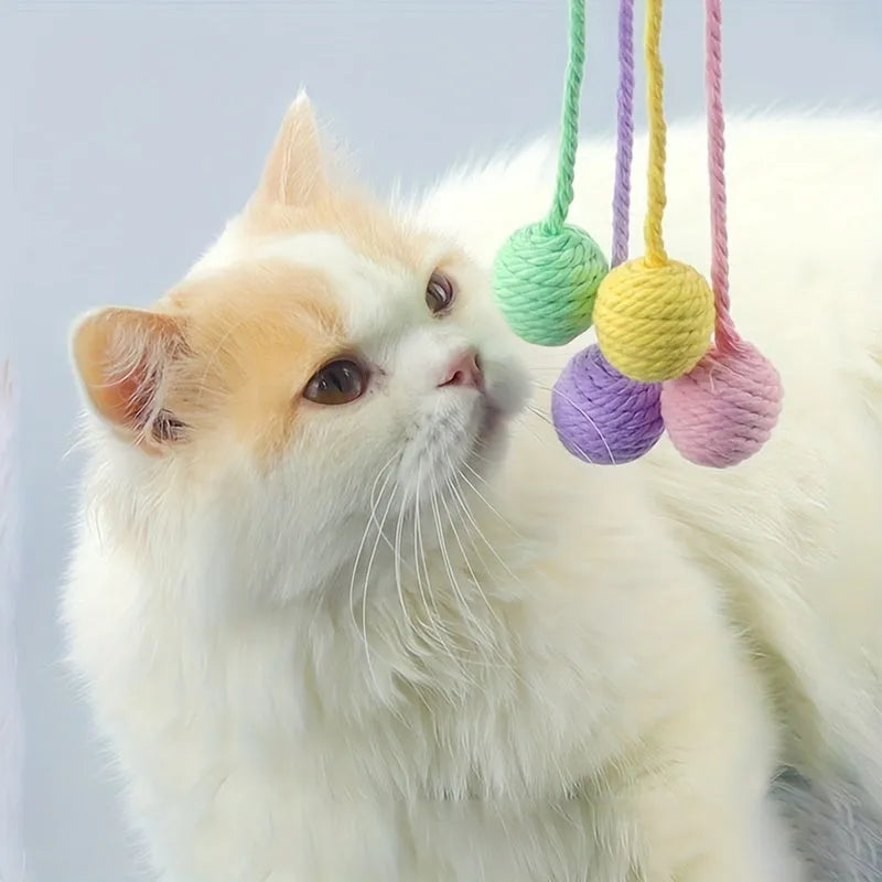 Cat toy ball with rope handle and bell inside in bright colours for kitten play