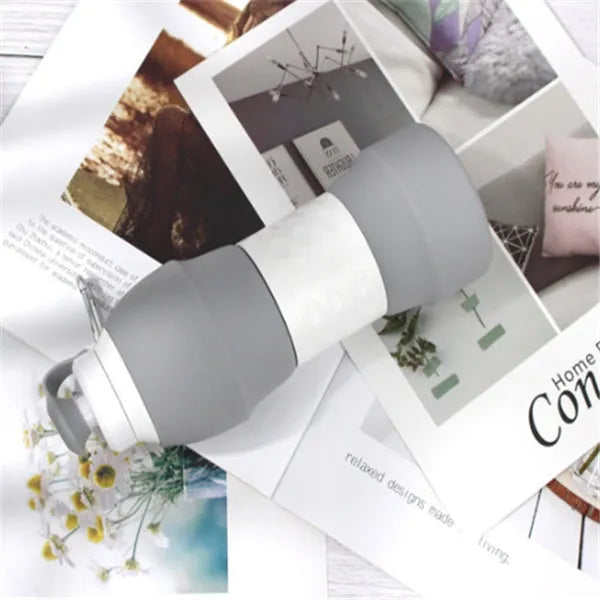 Silicone folding water bottle 580ml in grey, collapsed and full size, food grade portable sport bottle