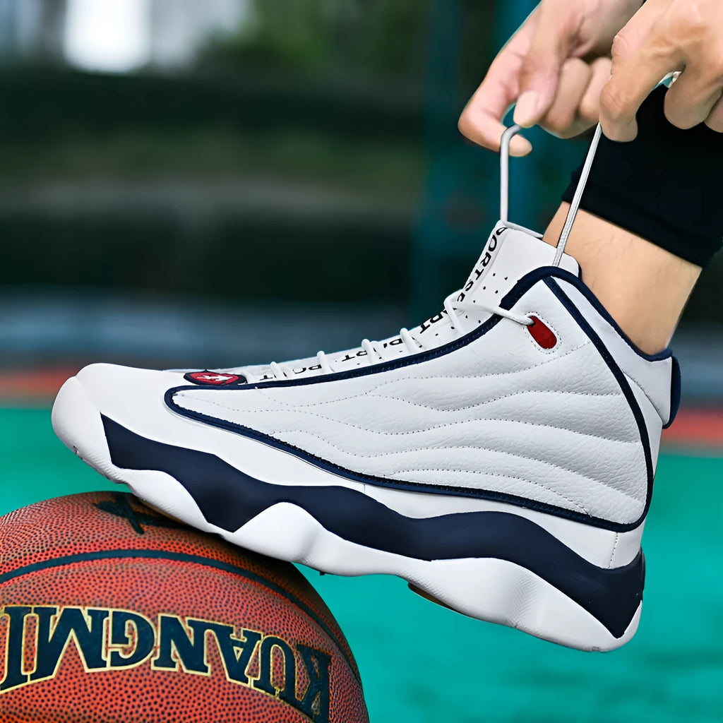 Men's high-top basketball shoes with thick rubber sole and mesh upper in white and red colourway.