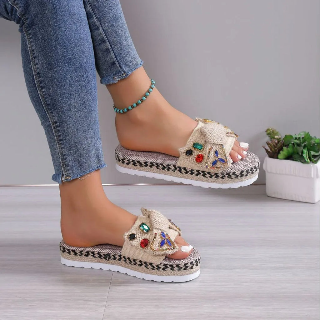 Beige women's platform sandals with bow detail, round toe, and cloth upper