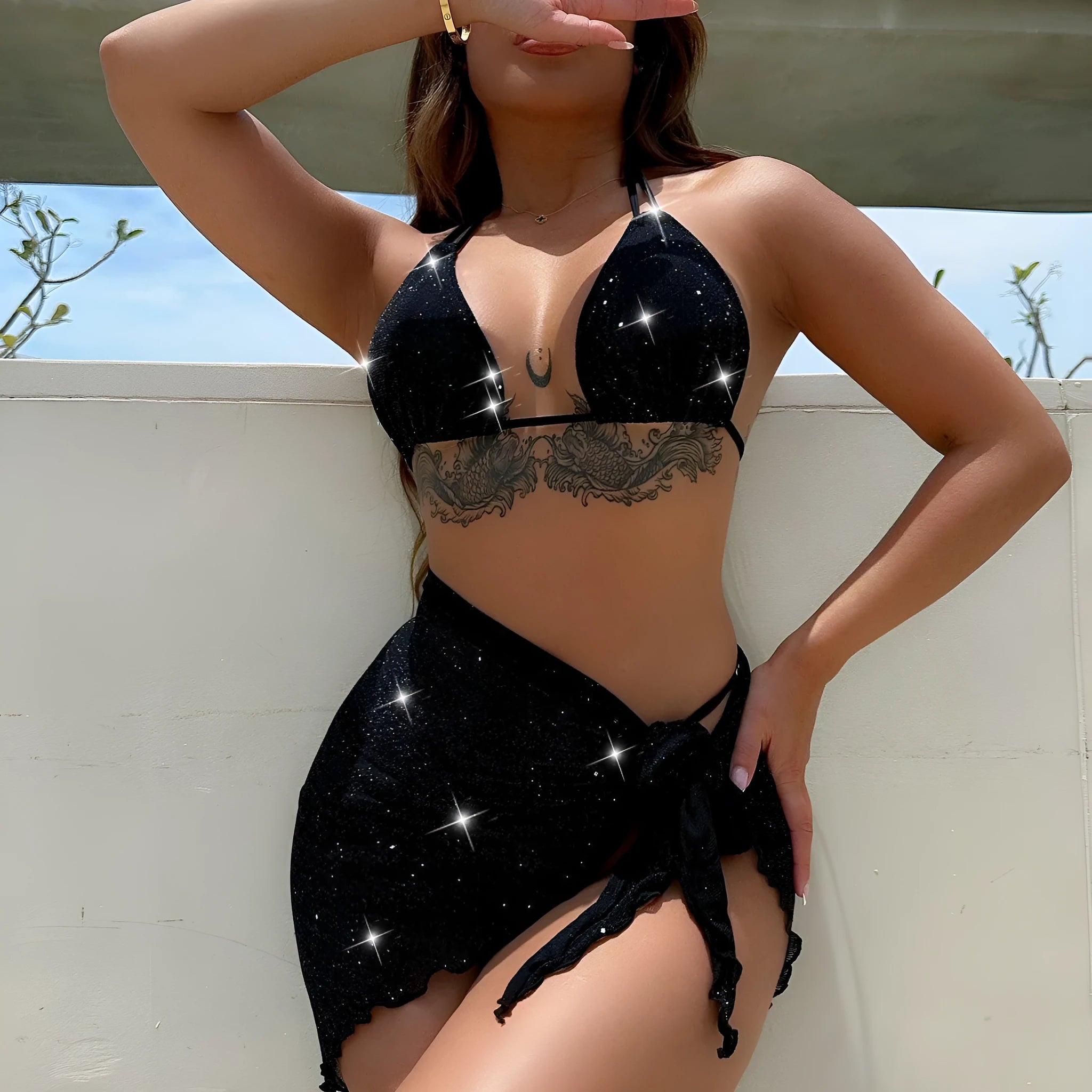 Black three-piece women's bikini swimsuit with separate top and shorts