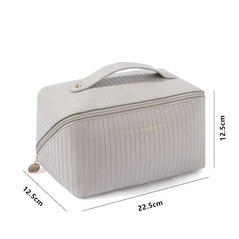 Vertical pattern makeup bag with cubic 22.5cm dimensions in beige, black, brown, grey, and pink colour options