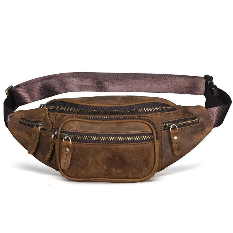 Brown leather shoulder messenger bag with single strap and large main compartment.