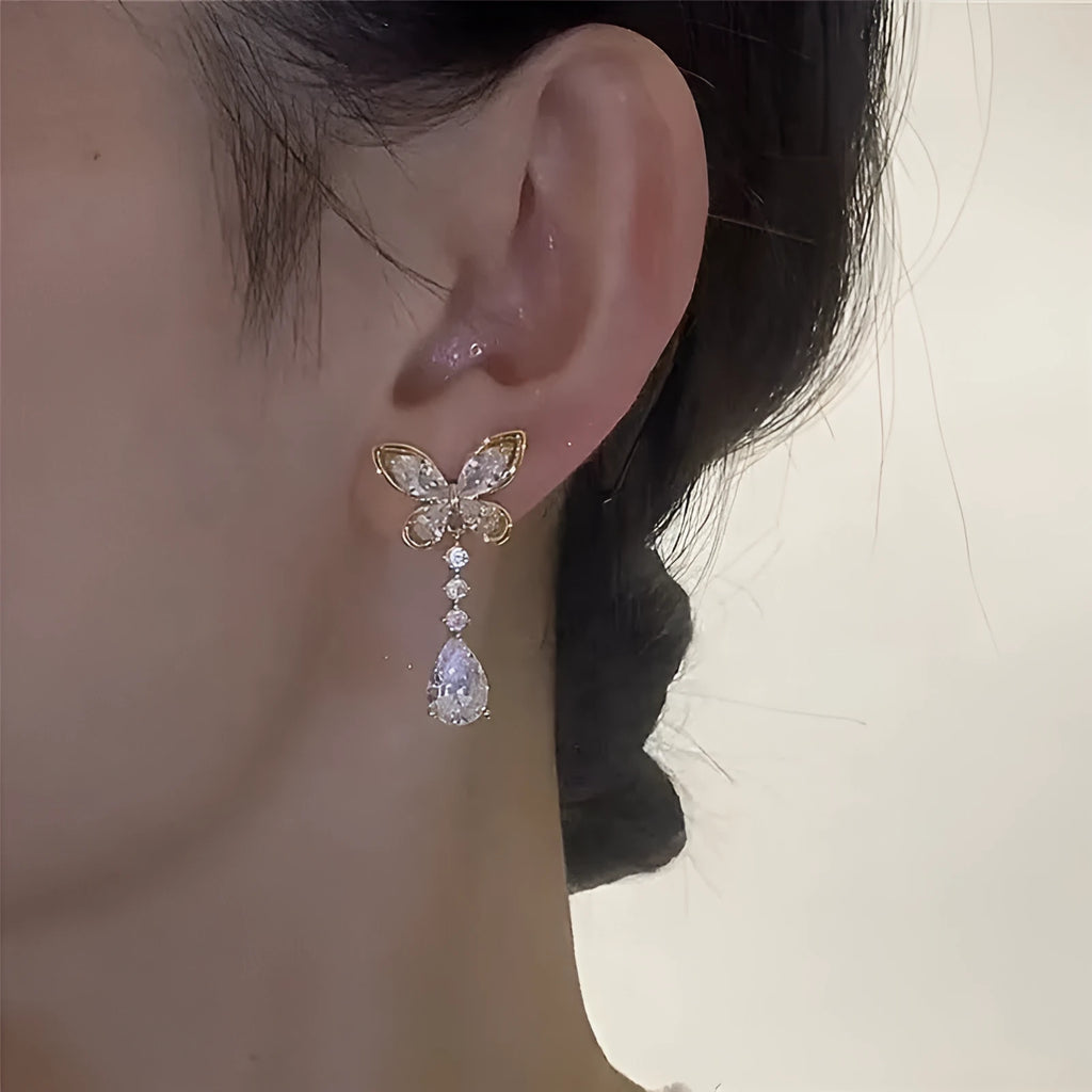 Platinum-coloured bow stud earrings made from zinc alloy with electroplated finish