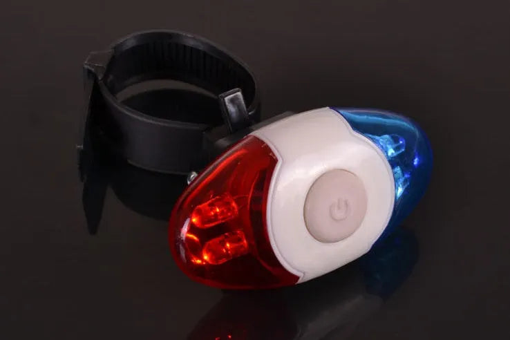 Red and blue LED bicycle tail light with an adjustable mounting base.