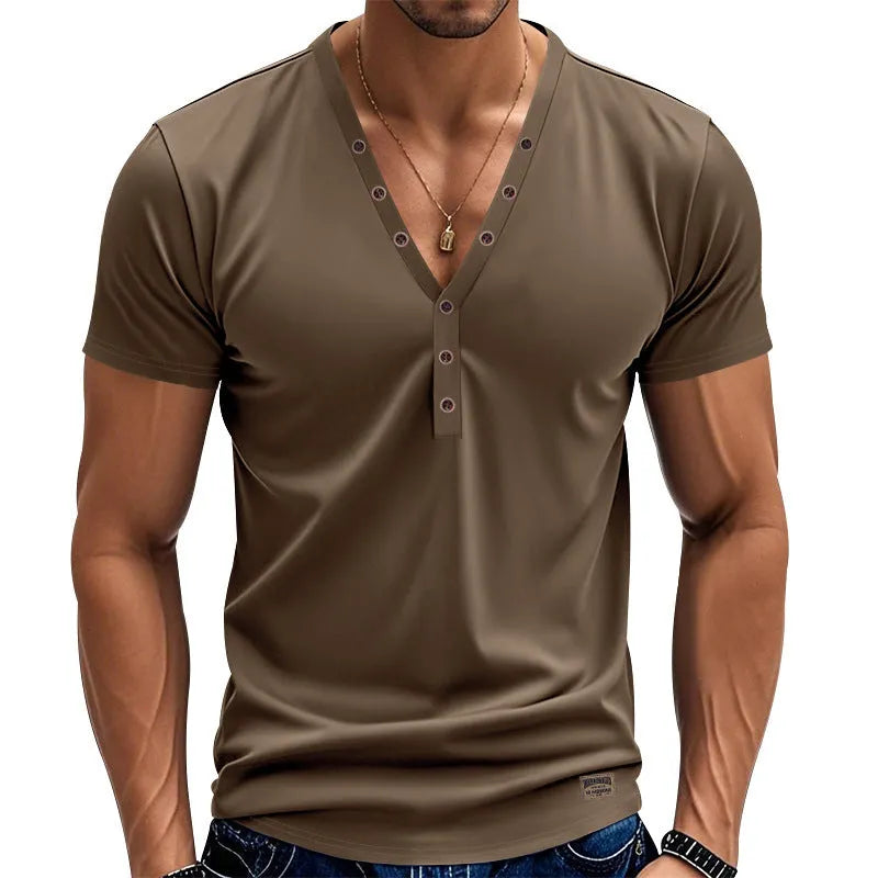 Man wearing a loose grey V-neck T-shirt with button detail on the front.