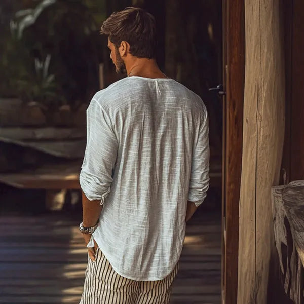Beige V-neck long-sleeved slim fit t-shirt laid flat.