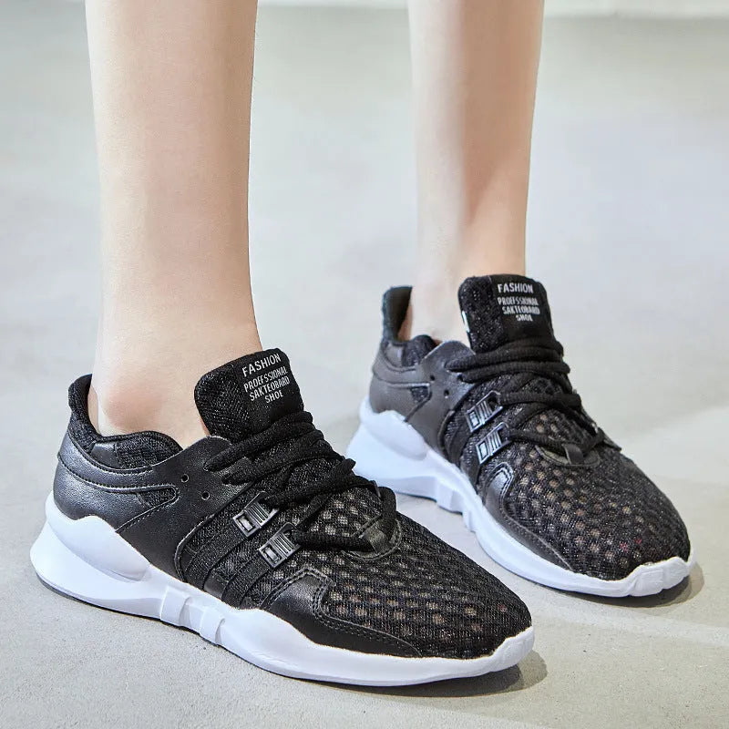 Low-top mesh sneaker with hollow breathable design and round toe in black and white colour options