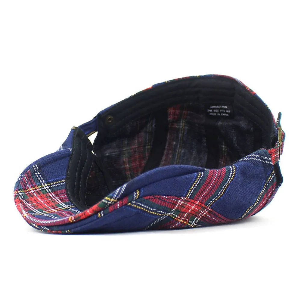 Retro plaid beret in red with curved brim and dome crown on adult head