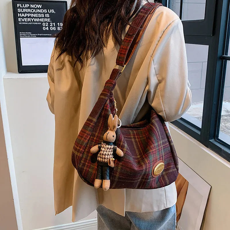 Large capacity soft woolen shoulder bag for women in khaki with pendant, horizontal square shape with sewing line detail.