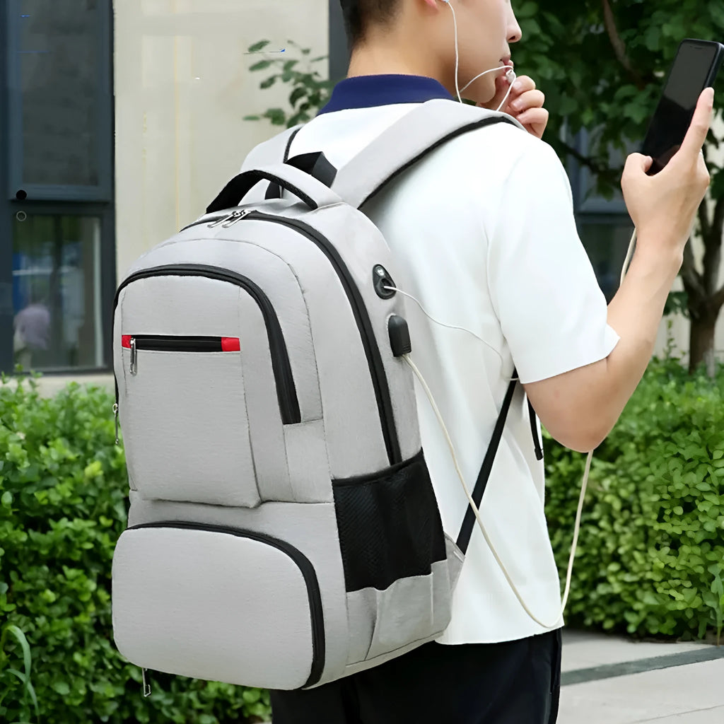 Light grey insulated Oxford cloth backpack with curved shoulder straps and pull rod belt for travel