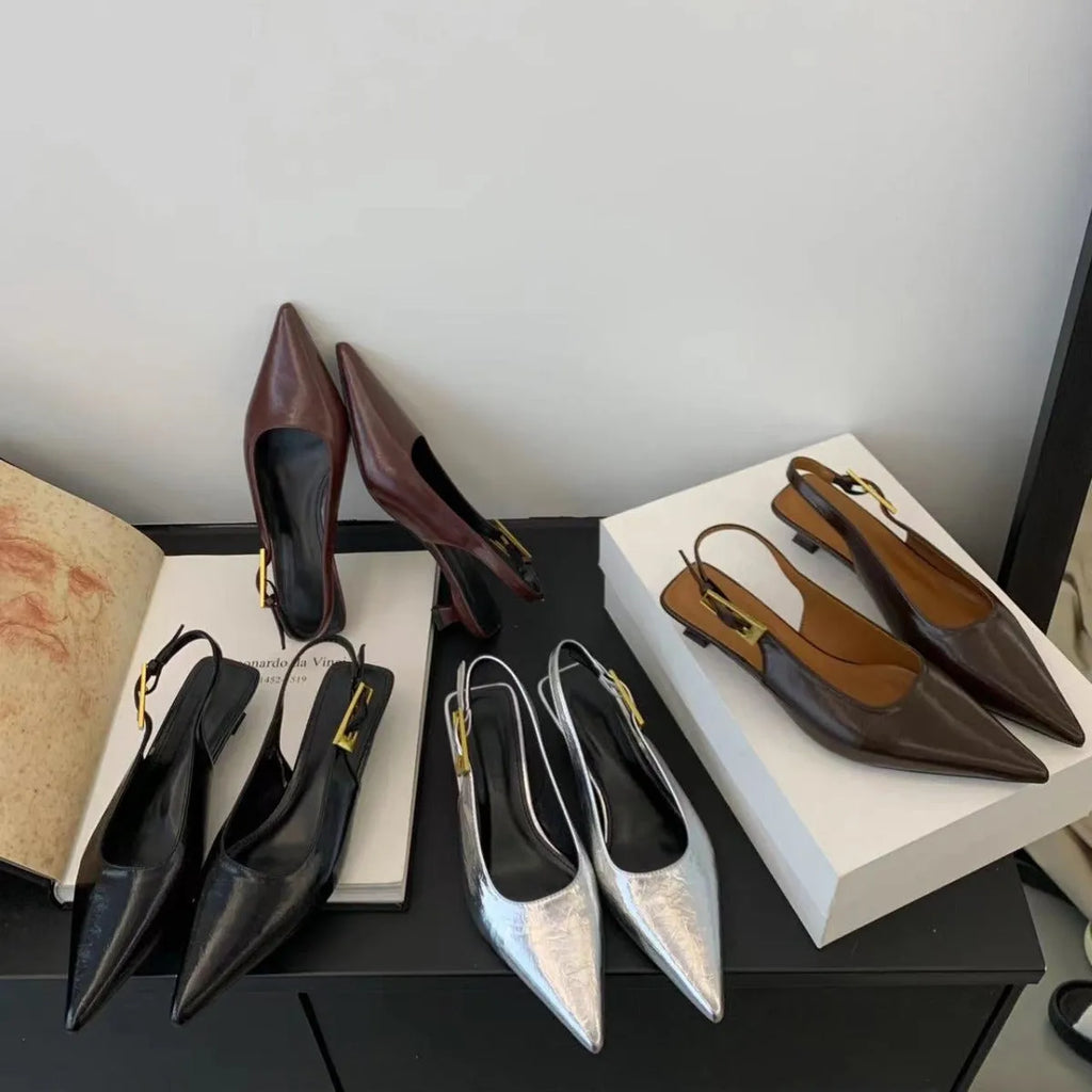 Thin low heel strap pointed leather shoes for women, black colour, side view showing heel height and ankle strap