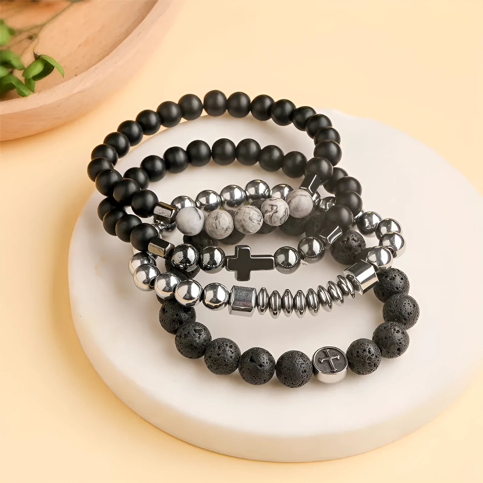 Close-up of a geometric cut volcanic agate bracelet with stainless steel finish, showing 10mm beads.