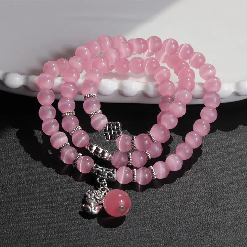 Crystal opal bracelet with 8mm cat eye bead and lucky cat charm in three-ring wrap design