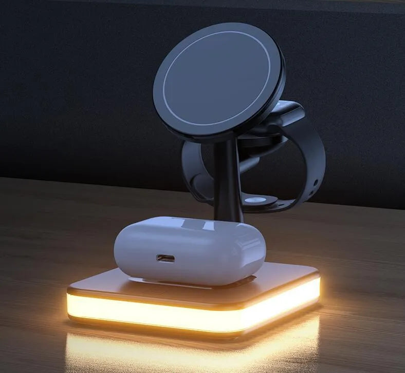 Three-in-one magnetic wireless charger with night light holding an iPhone, Apple Watch, and AirPods on a desk