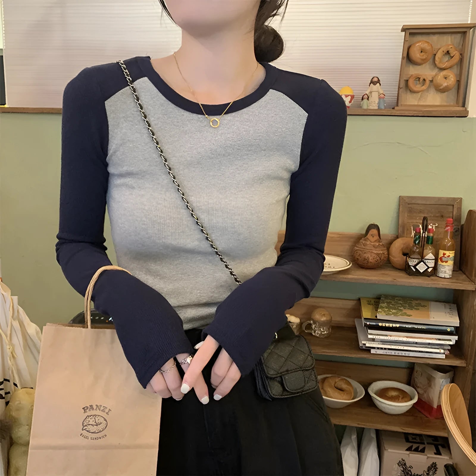 Dark blue oversized slim-fit women's viscose top with long princess sleeves and embroidery detail.