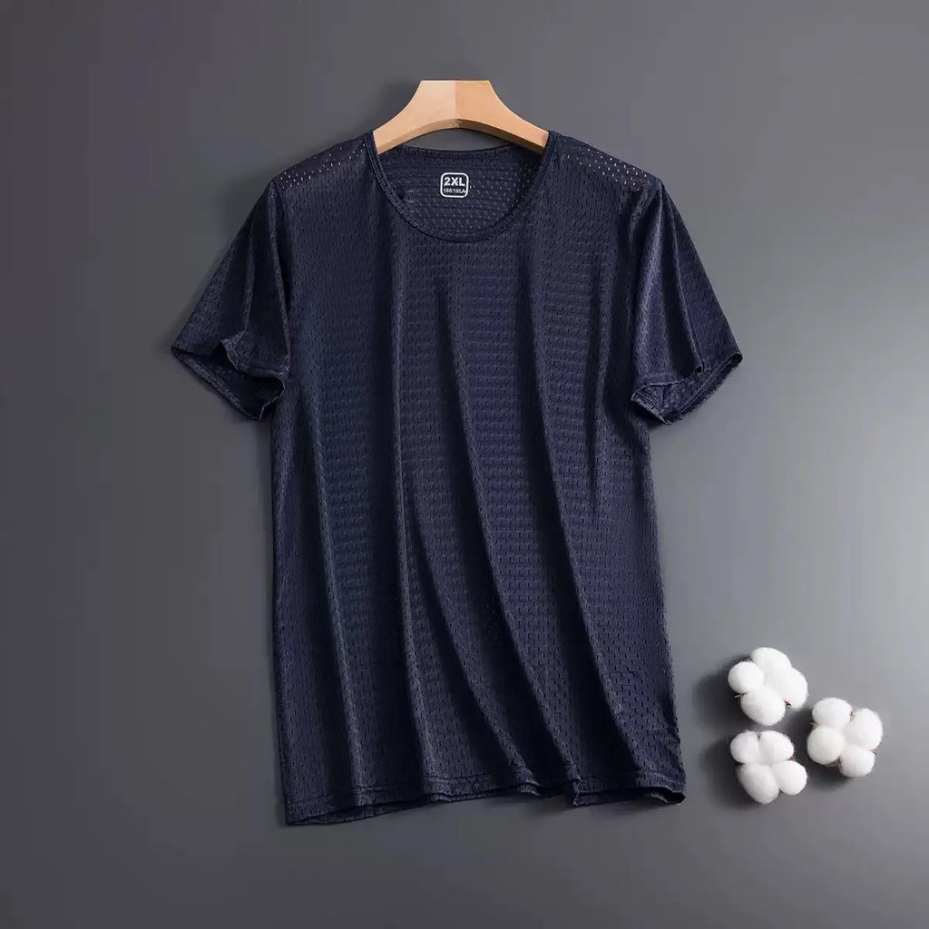 Man wearing a loose-fit black Ice Silk short sleeve t-shirt with crew neck for summer.