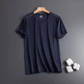 Man wearing a loose-fit black Ice Silk short sleeve t-shirt with crew neck for summer.