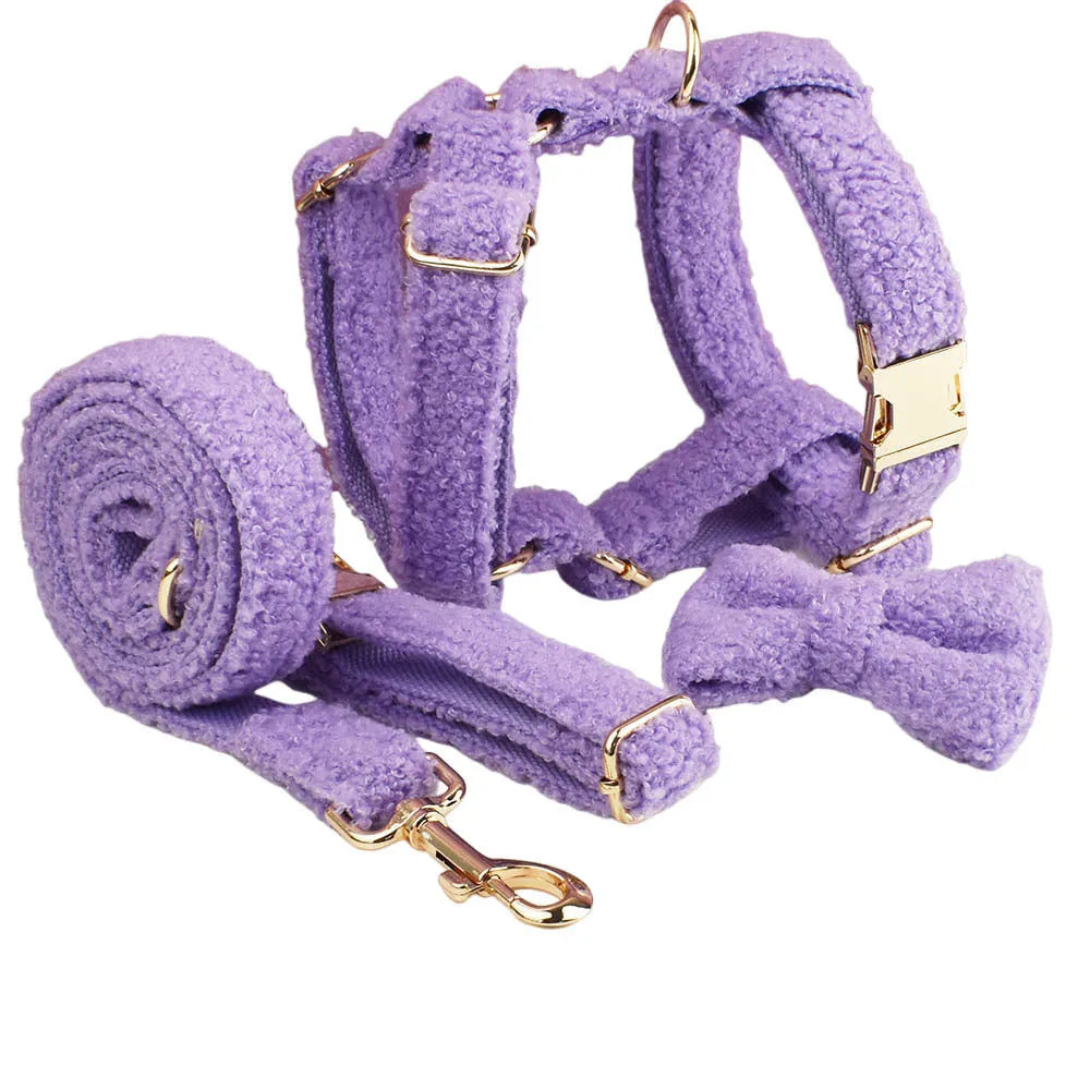 Purple cloth dog collar, leash, bow and vest four-piece set for small dogs on white background