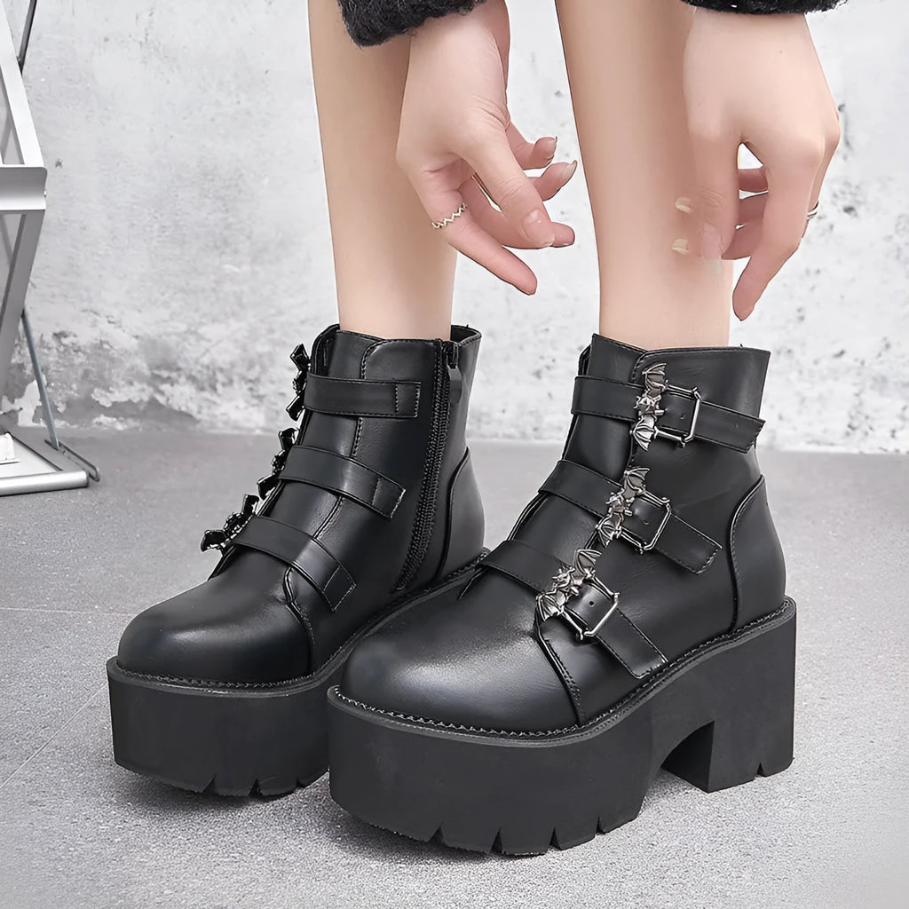 Black women's punk Martin boots with bat buckle, thick heel, and side zipper.