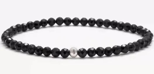 Geometric bracelet with obsidian, blue san and black agate beads showing round and chamfered square designs