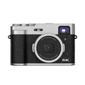 Black 5K HD digital camera with dual lenses, a 2.88-inch screen, and optical viewfinder on top.