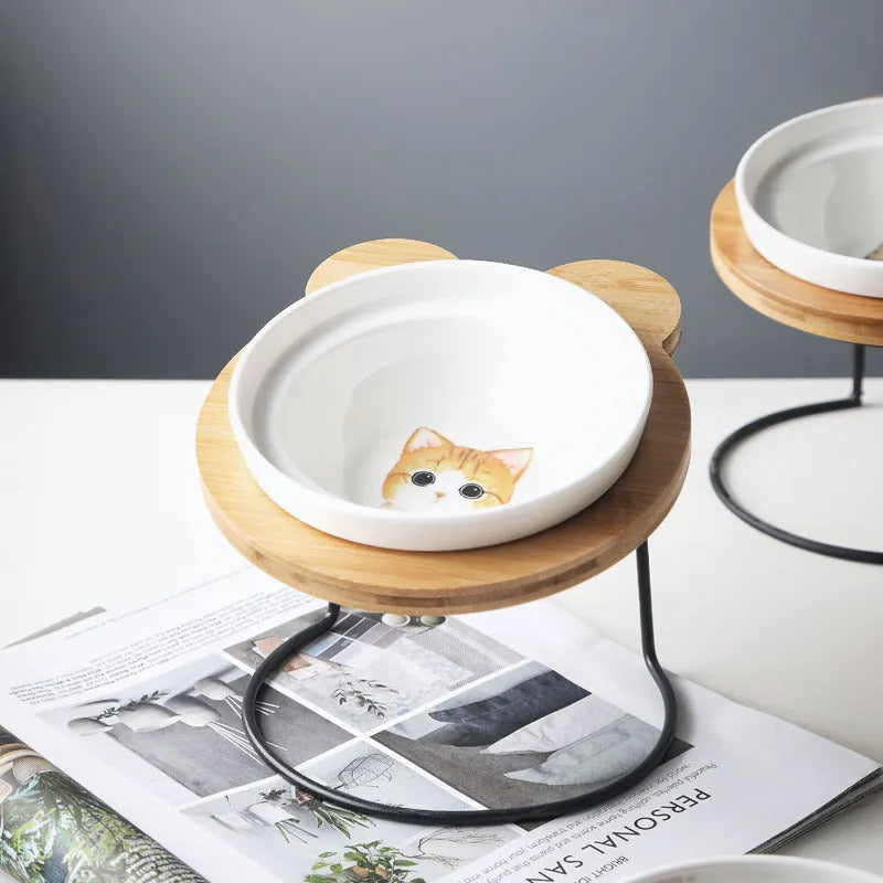 Ceramic cat bowl holder with rack and cat face design, elevated to protect spine