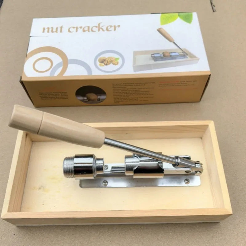 Mechanical walnut cracker with wood body and aluminium mechanism on a table