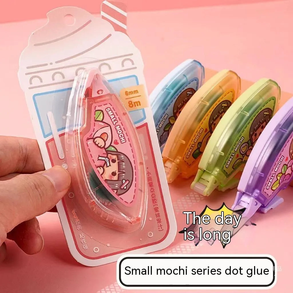 Hand account dotting glue dispenser in peach juice colour on a card pack