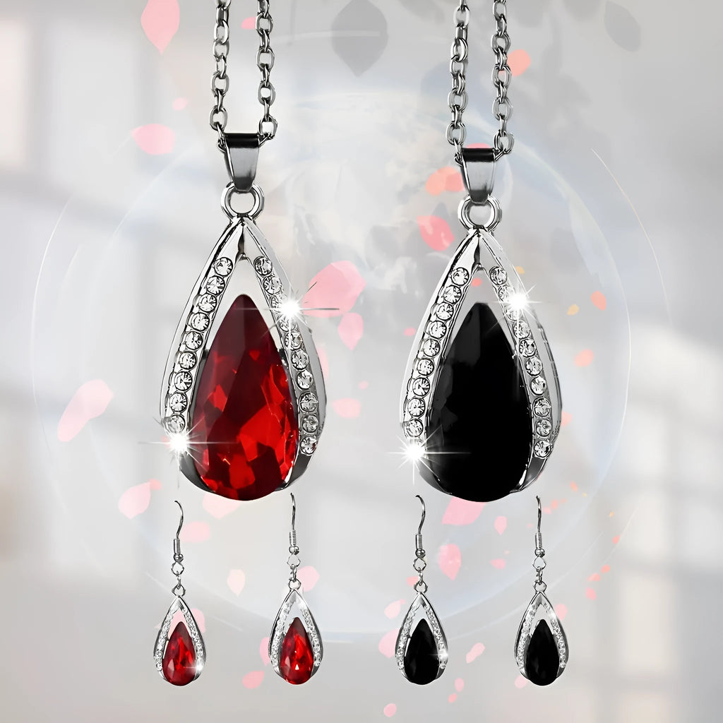 Teardrop pendant necklace and matching earrings set in black or red alloy with water droplet design elements